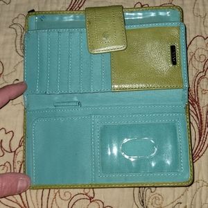 Used-Green and blue fossil wallet. Has few pen marks on back and inside.